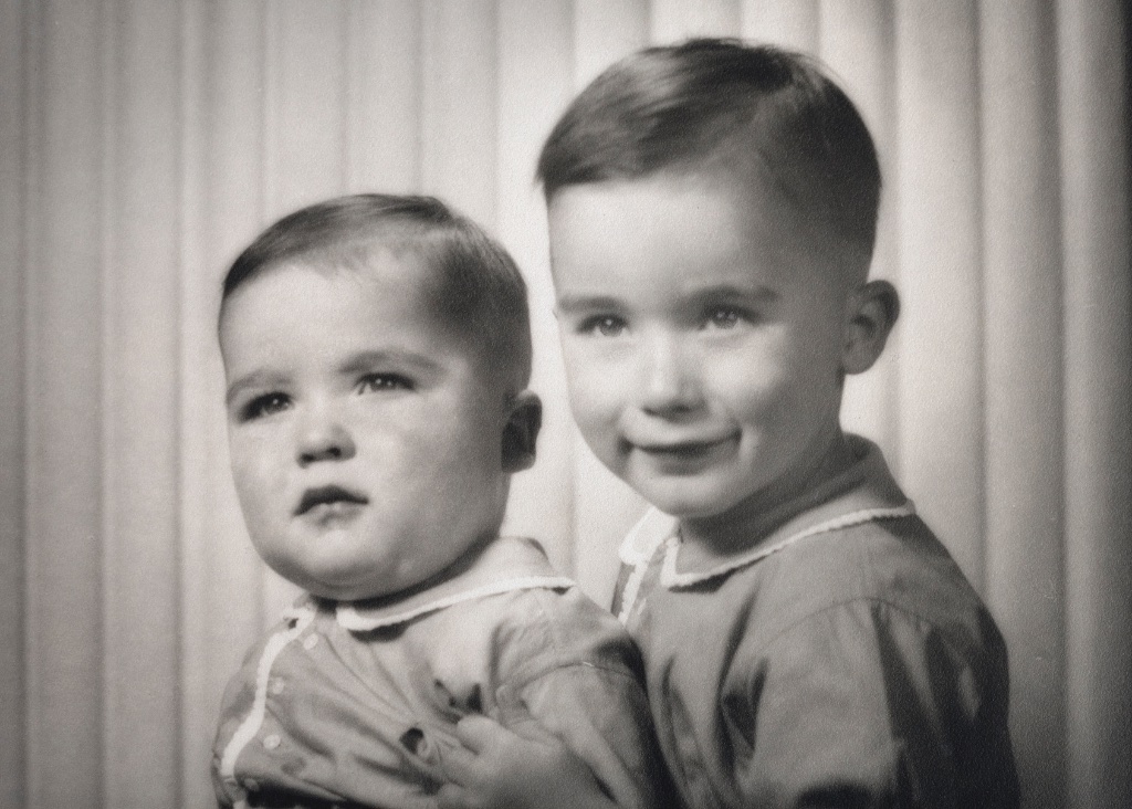 Alan (right, the older boy) with his baby brother Phil — studio portrait, est. 1941